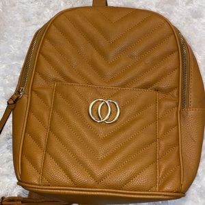 Tan zip-based backpack